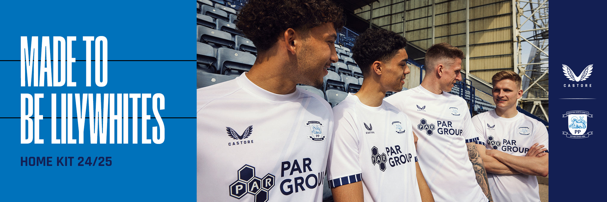 Group of four junior players in white home kits with one in a yellow shirt on stadium steps