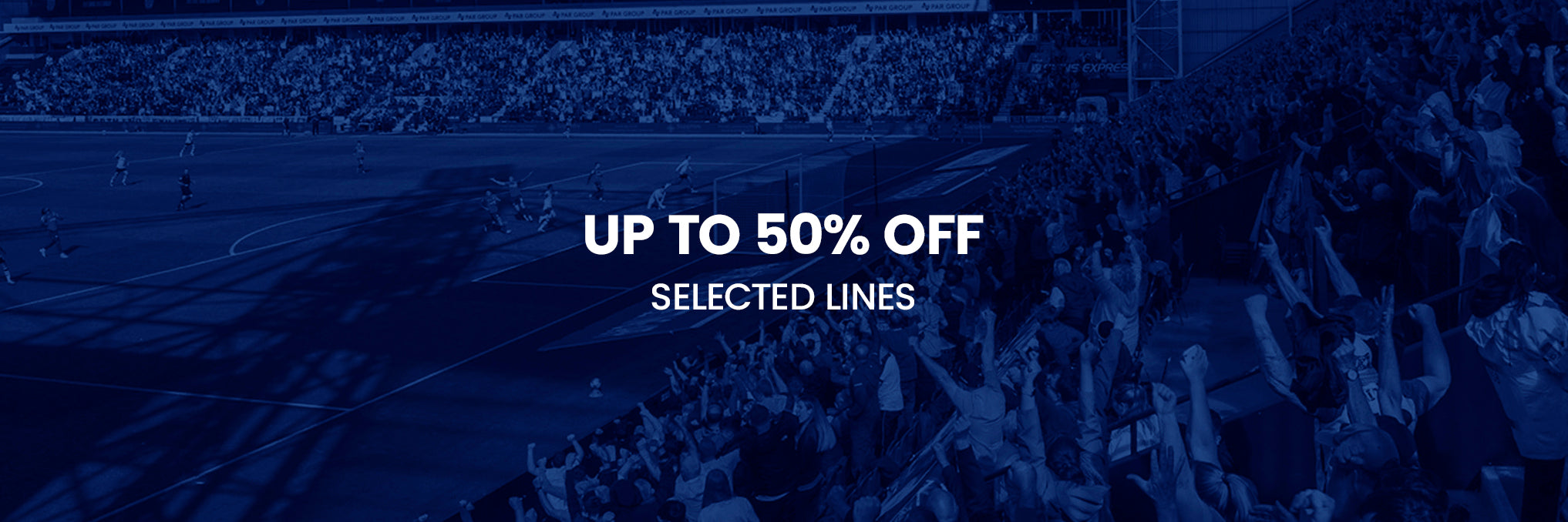 Blue tinted stadium banner announcing up to 50% off selected lines.