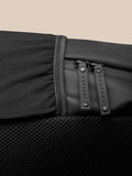 Core Backpack in black with ProTek finish; close view of zipper pulls and mesh side panel