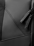 Detail of black Core Holdall zipper pulls with branded CASTORE tabs