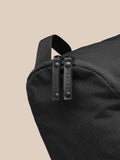 Close up of black Active Boot Bag zipper pulls with CASTORE branding.