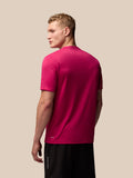 Three quarter view of pink Adapt Training T-Shirt showing the chest wings graphic and AerTek branding at the lower back