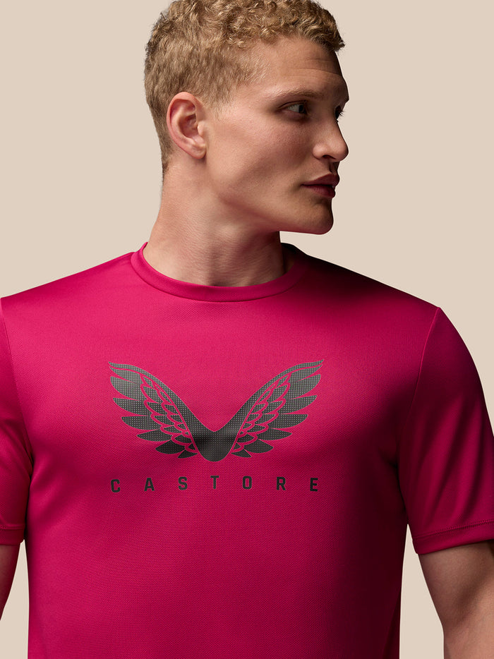 Back view of pink Adapt Training T-Shirt on a male model with a plain back and crew neckline
