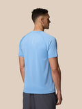 Back view of sky blue Adapt Training T-Shirt showing Castore branding along the spine.