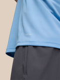 Close up of sky blue Adapt Training T-Shirt fabric with AERTEK branding on the hem