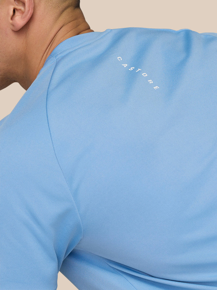 Close-up of back shoulder on sky blue Adapt Training T-Shirt showing Castore branding.