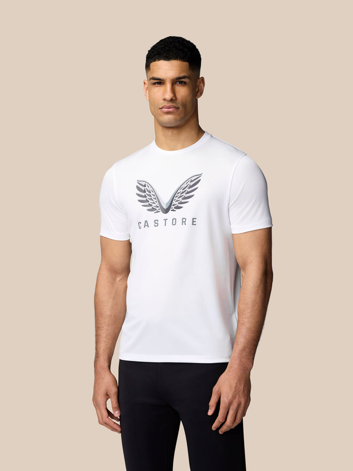 Male model wearing white Graphic Training T-Shirt with Castore wings graphic on chest