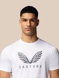 Portrait of male model in white Castore graphic training T shirt showing the wings graphic on the chest.