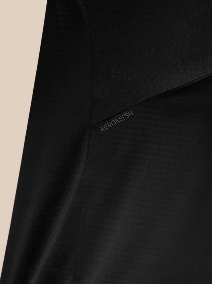 Back view close up of black Apex Training Quarter Zip Top showing Aeromesh panel and diagonal shoulder stripe.