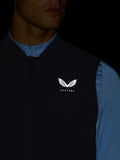 Close-up of navy Apex Training Gilet chest featuring the Castore logo on the left side