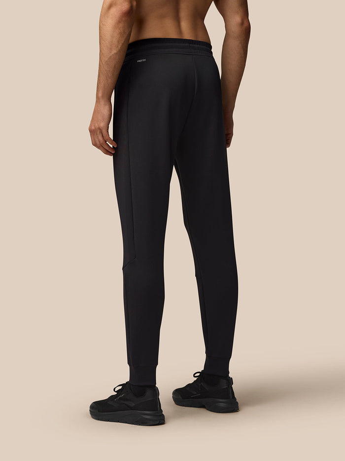 Back view of black Flex Joggers showing Protek branding at the left rear