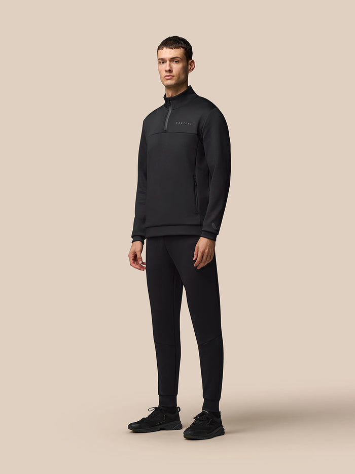 Three quarter rear view of black Flex Joggers with Protek branding at the left rear and seam detailing