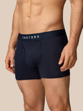 Model wearing navy Castore boxer shorts with a secure waistband and curved stitching detail