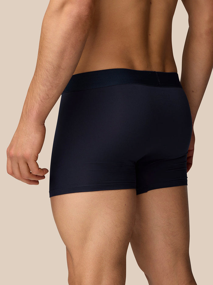 Rear side view of navy Castore boxer shorts on a model highlighting waistband and seam details