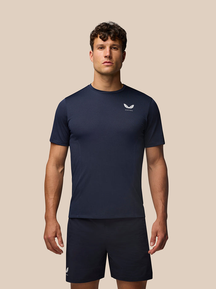 Male model in Midnight Navy Apex Training T-Shirt with a crew neck and raglan sleeves.