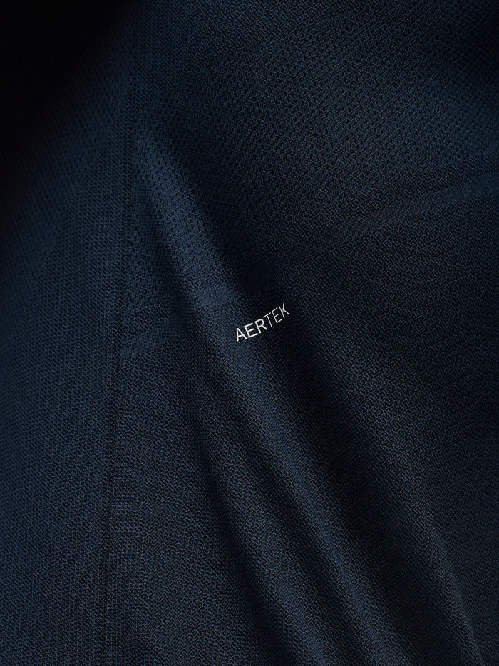Close up of midnight navy Apex Training fabric showing textured mesh and AERTEK branding.