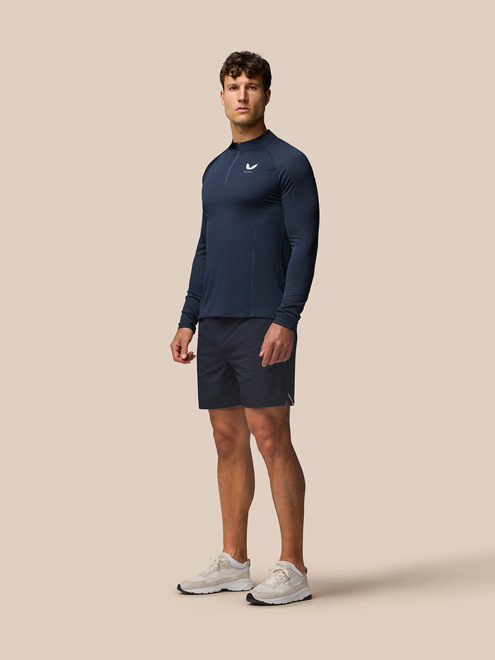 Male model wearing Apex Training Quarter Zip Top in midnight navy with stand collar