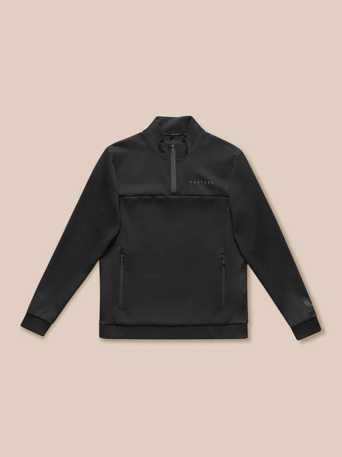 Flat lay of black Flex Lifestyle 1/4 Zip top showing zip pockets and Castore branding on the chest.