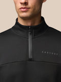 Close-up of black Flex Lifestyle 1/4 Zip top with stand collar, front zipper and Castore branding on the chest.