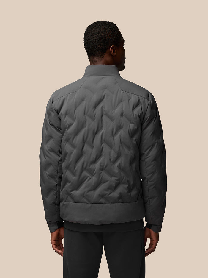 Back view of charcoal Quilts lightweight padded jacket showing the all over quilted pattern