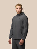 Male model wearing charcoal Lightweight Flex Jacket with hood, front full zip, zip pockets and left chest logo.
