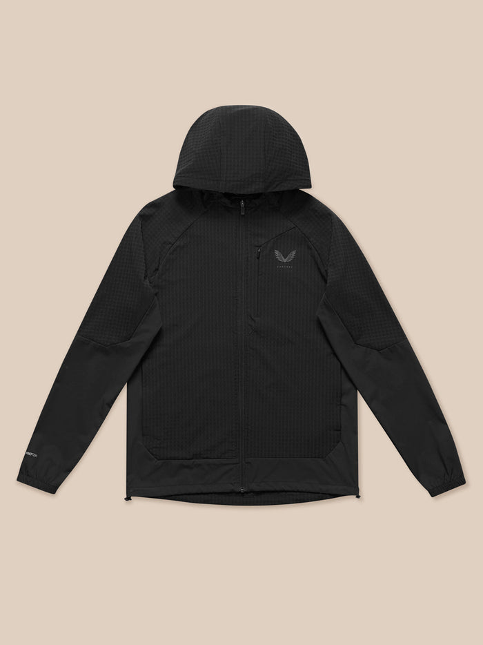 Front view of a model wearing the black Flex Winterised Jacket with full zip and hooded silhouette