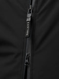 Close up of a black jacket zipper with a Castore branded pull against dark fabric