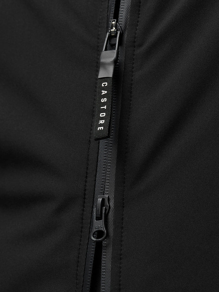 Close-up of black jacket zipper with Castore branding on the zipper pull