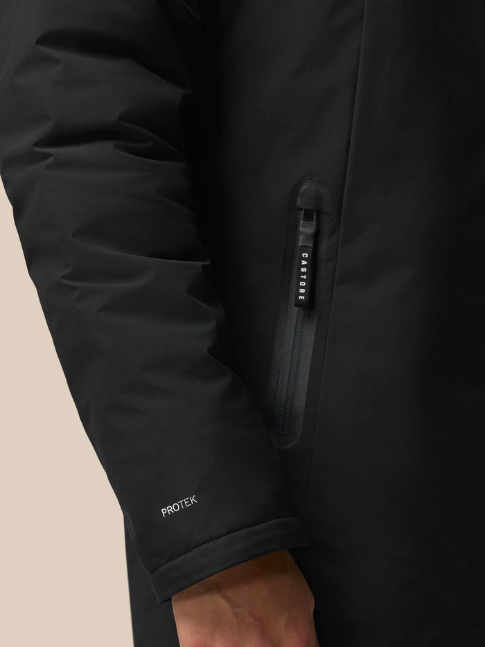 Cuffed sleeve of the black ProTek jacket with ProTek branding visible on the cuff.