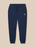Full view of navy Travel Lifestyle Joggers laid flat showing drawstring waist and Castore logo on thigh