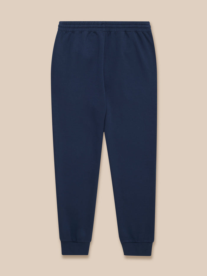 Navy Travel Lifestyle joggers laid flat with elastic waistband and cuffed hems