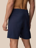 Close up of navy Flex Shorts waistband and side pocket with subtle branding on the leg
