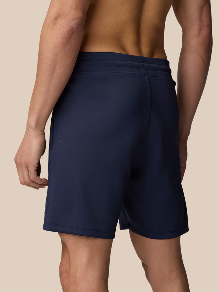 Close up of navy Flex Shorts waistband and side pocket with subtle branding on the leg