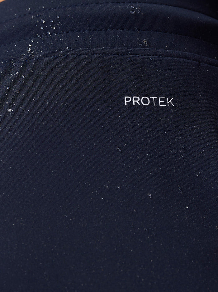 Close-up of navy ProTEK fabric with water droplets on Flex Shorts