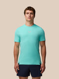 Male model in light aqua Zone Training T-Shirt with navy shorts.