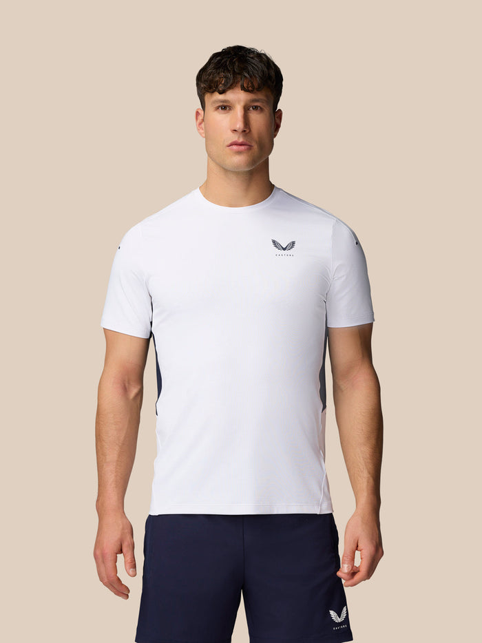 Model wearing Apex Training T-Shirt in white with crew neck and chest logo.