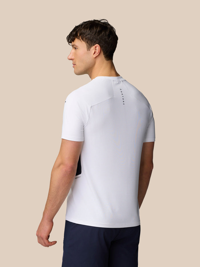 Back view of a model wearing white Apex Training T-Shirt with Castore branding on the upper back.