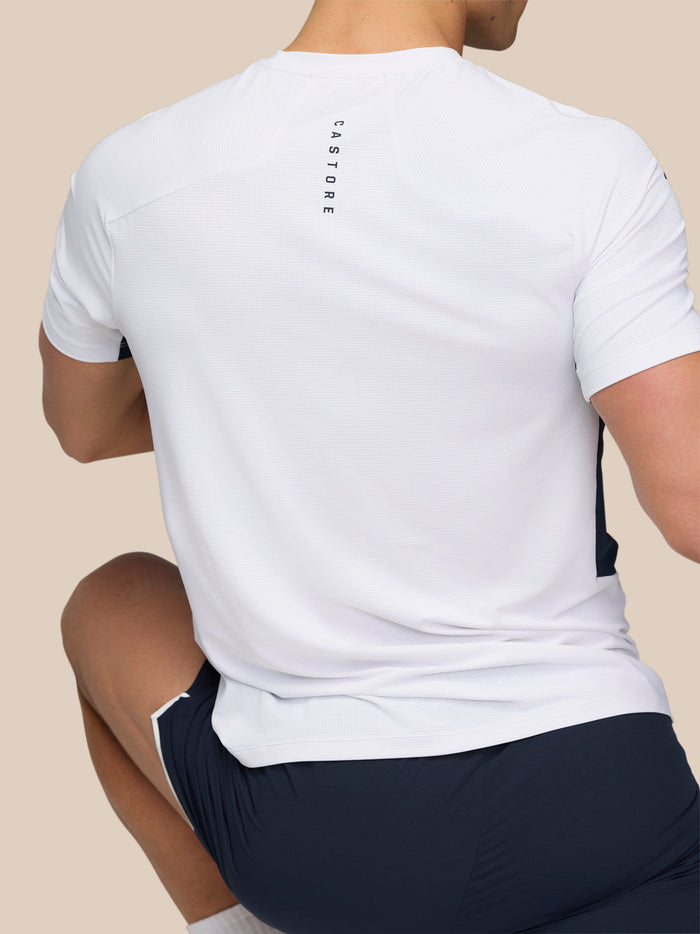 Back view of a man in white Apex Training T-Shirt showing CASTORE branding down the upper back