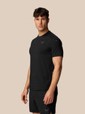 Male model wearing Apex Training T-Shirt in black with reflective Castore branding.