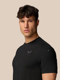 Side profile of a man in black Apex Training T Shirt with a small Castore logo on the chest.