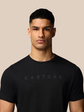 Close-up of male model wearing a black Graphic Lifestyle T-Shirt with subtle Castore lettering across the chest.
