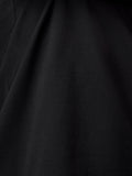 Close-up of black fabric showing texture and drape of the T shirt