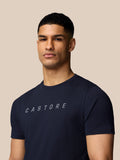 Close up of a man wearing navy Castore graphic T shirt showing the front design