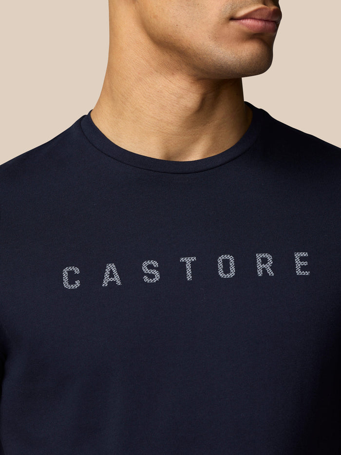 Close up of navy Castore T shirt front graphic with CASTORE lettering