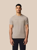 Front view of a man in Rock Grey Castore graphic T-shirt with crew neck and short sleeves