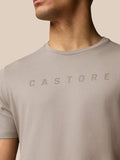 Close-up of the front Castore graphic on beige Rock Grey T-shirt.