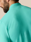 Back view of light aqua Zone Training 1/4 Zip Top showing ribbed knit panel across the upper back