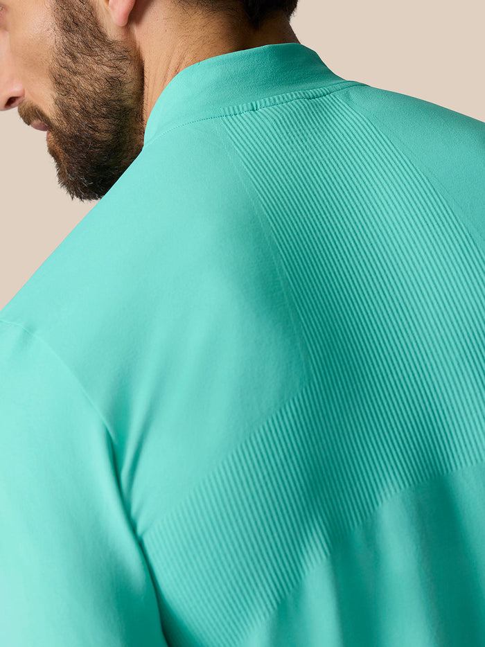 Back view of light aqua Zone Training 1/4 Zip Top showing ribbed knit panel across the upper back