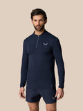 Male model in midnight navy Zone Training 1/4 Zip Top with long sleeves and chest logo
