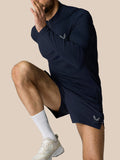 Zone Training 1/4 Zip Top in Midnight Navy worn by a model; high neck with a quarter zip and reflective branding